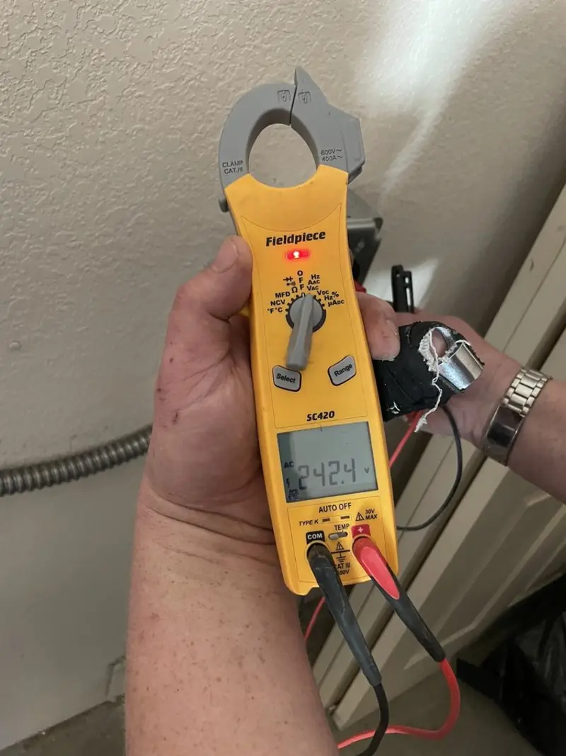 Voltage testing with clamp meter during Electrical Installation Services in Auburn